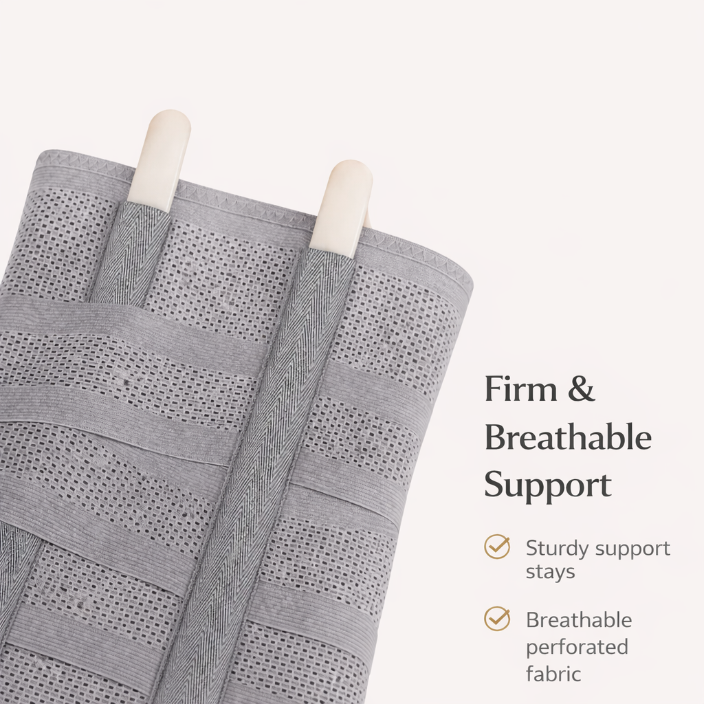 Gray perforated posture support belt with firm support stays and breathable fabric.