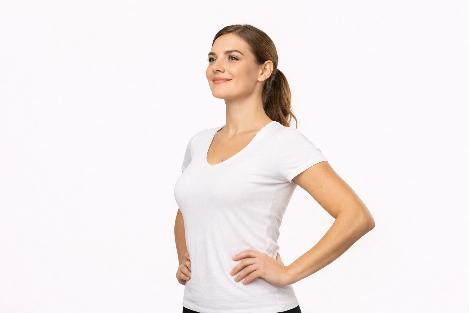Confident woman with good posture in a white t-shirt against a white background