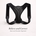 Adjustable black posture corrector for back and shoulder alignment on a light background