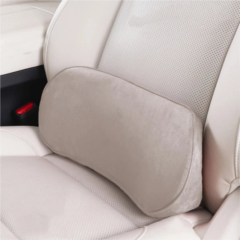 Memory foam lumbar support cushion on a light-colored car seat for back support
